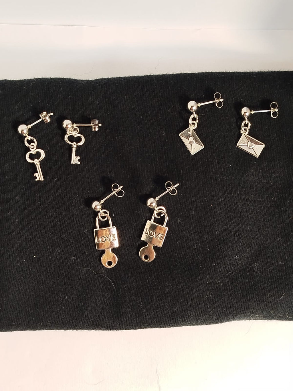 Pendientes Plateados con diferentes dijes